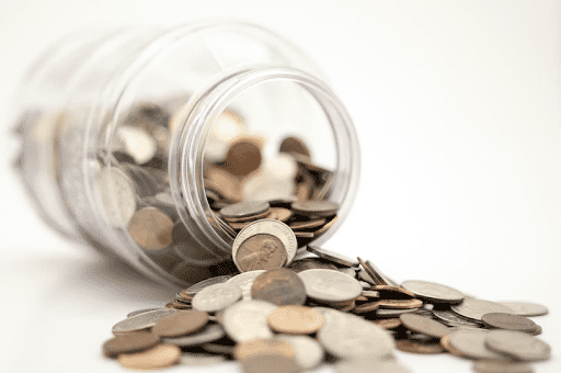 fallen jar of coins e1642019860700